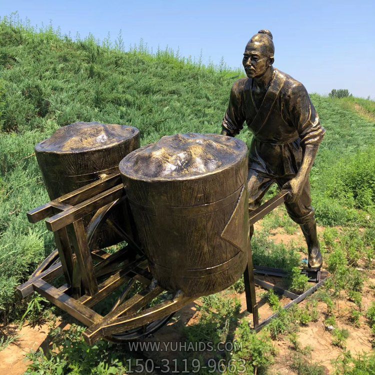 用獨(dú)輪車運(yùn)糧食的農(nóng)民雕塑